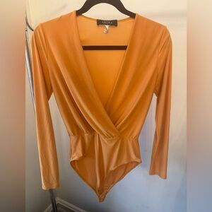 AKIRA Orange Surplice Bodysuit